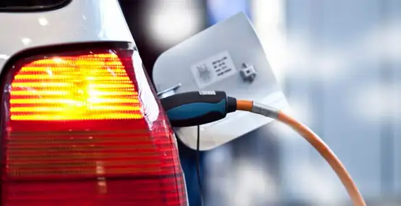Electric car plugged into EV charger after professional installation in Savannah, GA