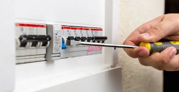 electrical panel upgrade service showing technician adjusting circuit breakers during system upgrade in Savannah, GA