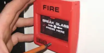 fire alarm installation service showing manual fire alarm pull station installed by licensed electricians in Savannah, GA