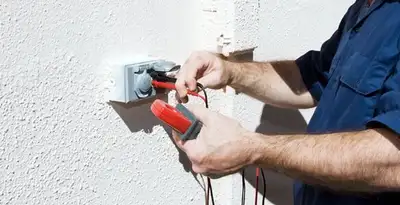 Electrician performing home electrical outlet and wiring inspection in Savannah, GA
