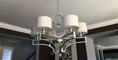 Modern chandelier installation with multiple light fixtures in Savannah, GA