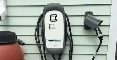 Outdoor electric vehicle charger installation on residential wall in Savannah, GA
