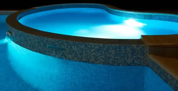pool light installation and repair services highlighting illuminated pool interior lighting in Savannah, GA