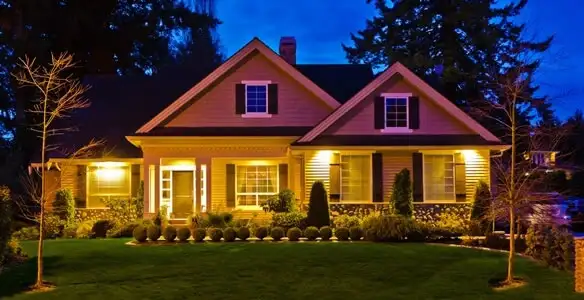 security light installation services illuminating a residential exterior at night in Savannah, GA