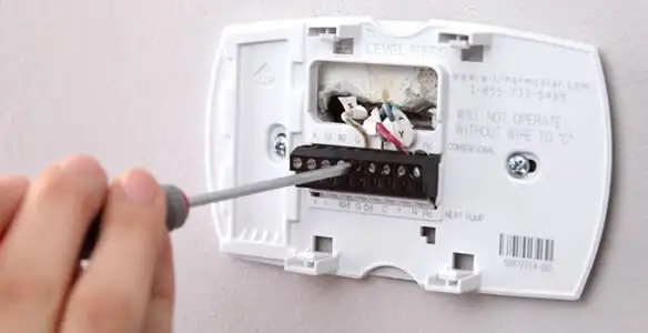 Thermostat installation service with proper wiring and secure wall mounting in Savannah, GA