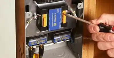 Whole home surge protection device being installed by a licensed electrician to protect electrical systems in Savannah, GA